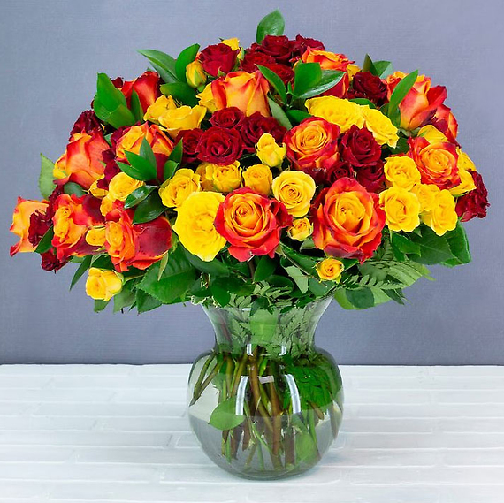 a picture of orange and red roses