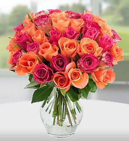 a picture of peach and organge roses